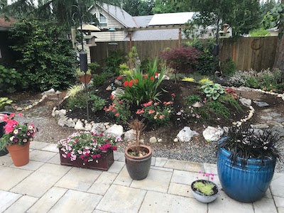 Fence and rounded gate leading to patio.